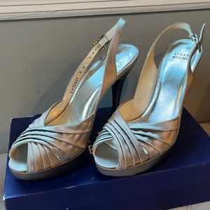 Never worn Stuart Weitzman silver satin slug back heels